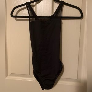 Black bodysuit with lace panels and intricate design